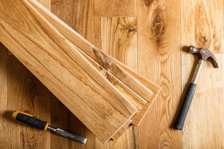 The process of house renovation with changing of the floor from carpets to solid oak wood, Should Hardwood Floors Match Throughout The House?