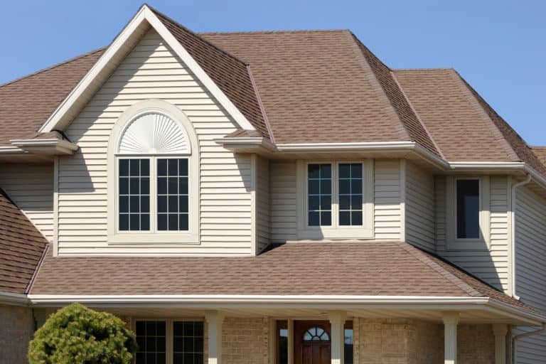 A luxurious mansion with brown vinyl sidings and brown roofings, How Durable Is Vinyl Siding?