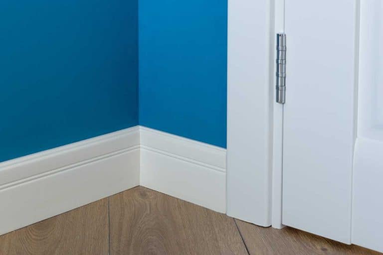Details in the interior with white baseboard and door casing, Should Baseboard And Casing Be the Same Thickness?