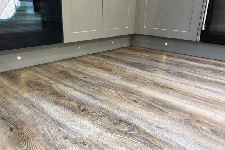 Oak wooden floorboards vinyl flooring in a modern home kitchen, Does Vinyl Flooring Need Padding? [And Why]