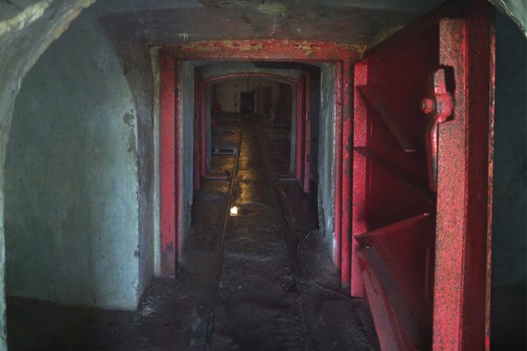 Old Fallout shelter with thick metal opened door