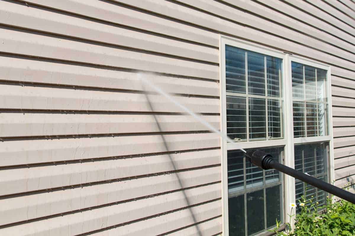 Power washing. House wall vinyl siding cleaning with high pressure water jet, Can You Power Wash Vinyl Siding?
