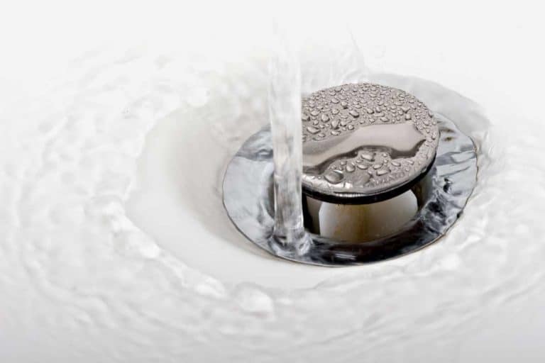 A running tap water in a sink, How Deep Can A Pop Up Drain Be?