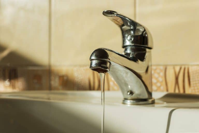 Water dripping from a leaking bathroom faucet, Why Do Bathroom Faucets Leak? [6 Most Common Problems Revealed]