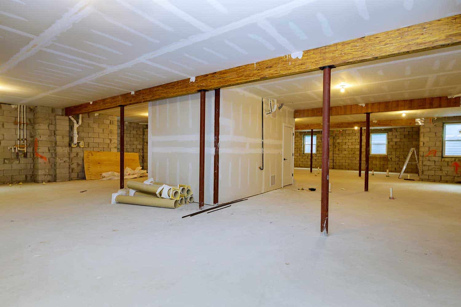 Unfinished basement framing interior wall of a new home construction