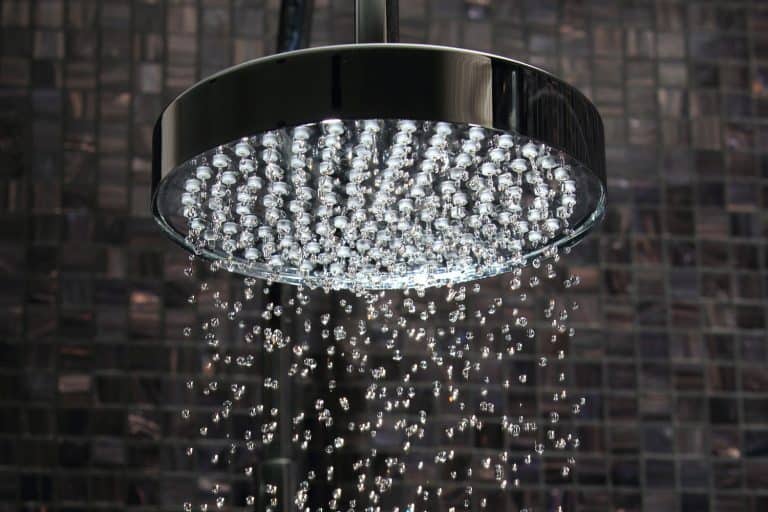 luxury shower in domestic bathroom with falling water against Italian glass mosaics with luxurious showerhead, Are Showerheads Universal?