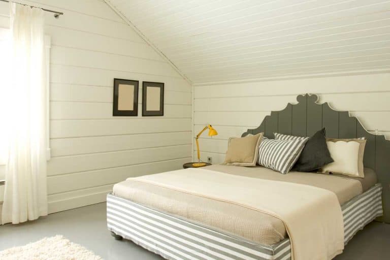 Wide bedroom interior in the attic, Can You Add An Attic To A House - And Is It Worth It?
