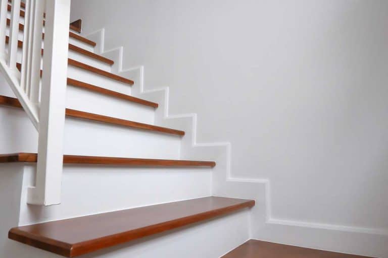 A brown wooden hardwood stair in modern residential house, Can I Use Liquid Nails For Stair Treads?