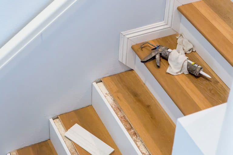 Hardwood Floor Installation On Stairs, Caulking Gun On Step, Crown molding stair, How To End Crown Molding At Stairs [7 Steps To Follow]