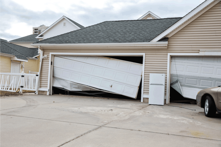 Picture taken after Hurricane Sandy. Damaged garage. Should You Crack Your Garage Door During A Hurricane