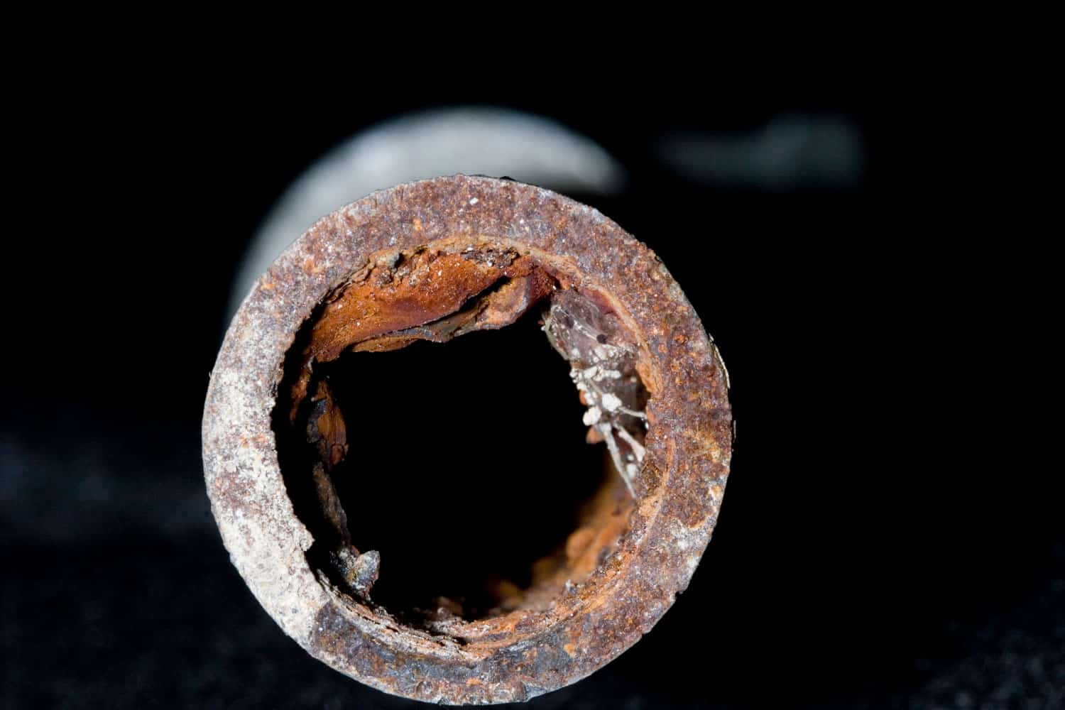 Rust accumulating inside a galvanized iron pipe