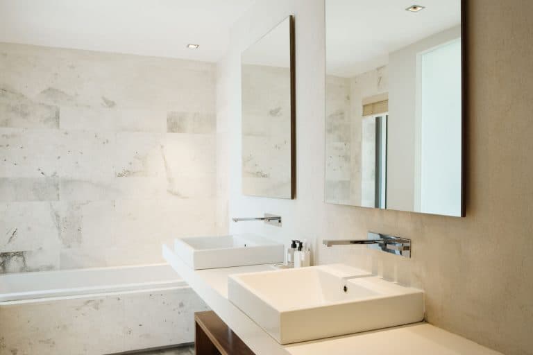 Interior of an elegant and modern bathroom with a modern sink and two huge mirrors, How to Fix A Gurgling Bathroom Sink