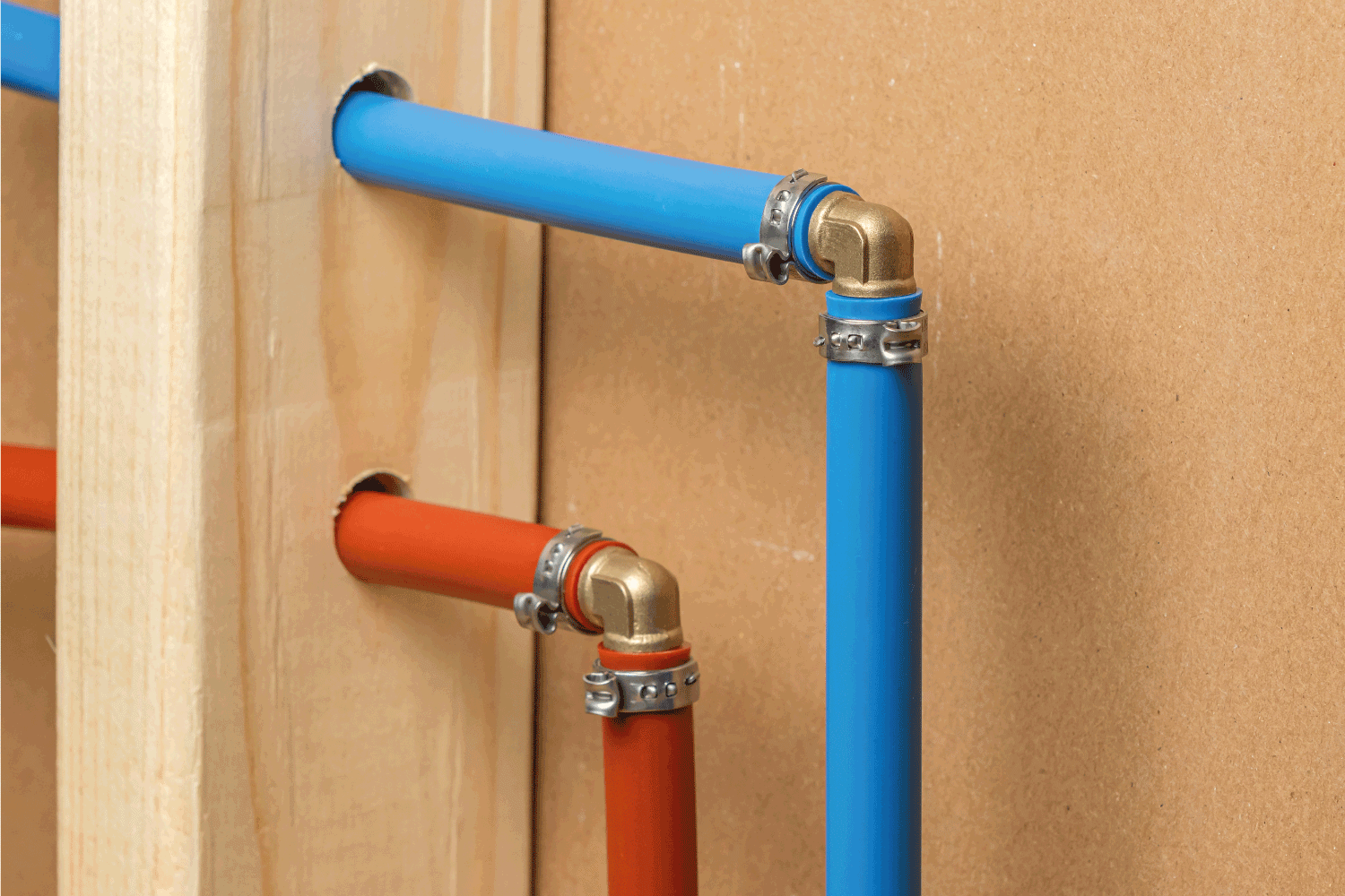 Pex plastic water supply plumbing pipe in wall of house