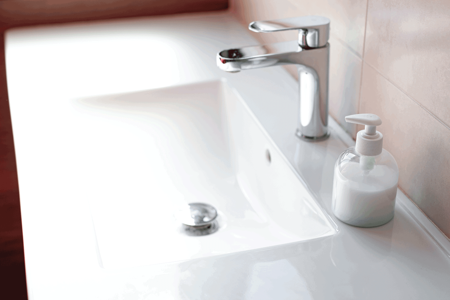 Sink soap dispenser to prevent coronavirus infection. How To Get Rid Of Ants In A Bathroom Sink