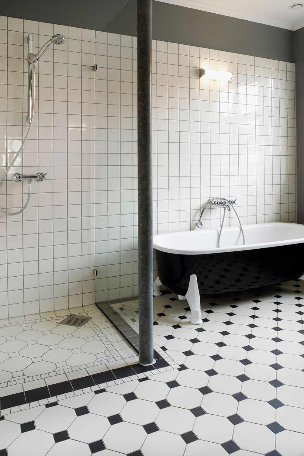 Totally renovated bathroom with shower cabin and bathtub,light cream coloured tiles on floor and wall, Should You Tile The Floor Or Walls First In A Shower?