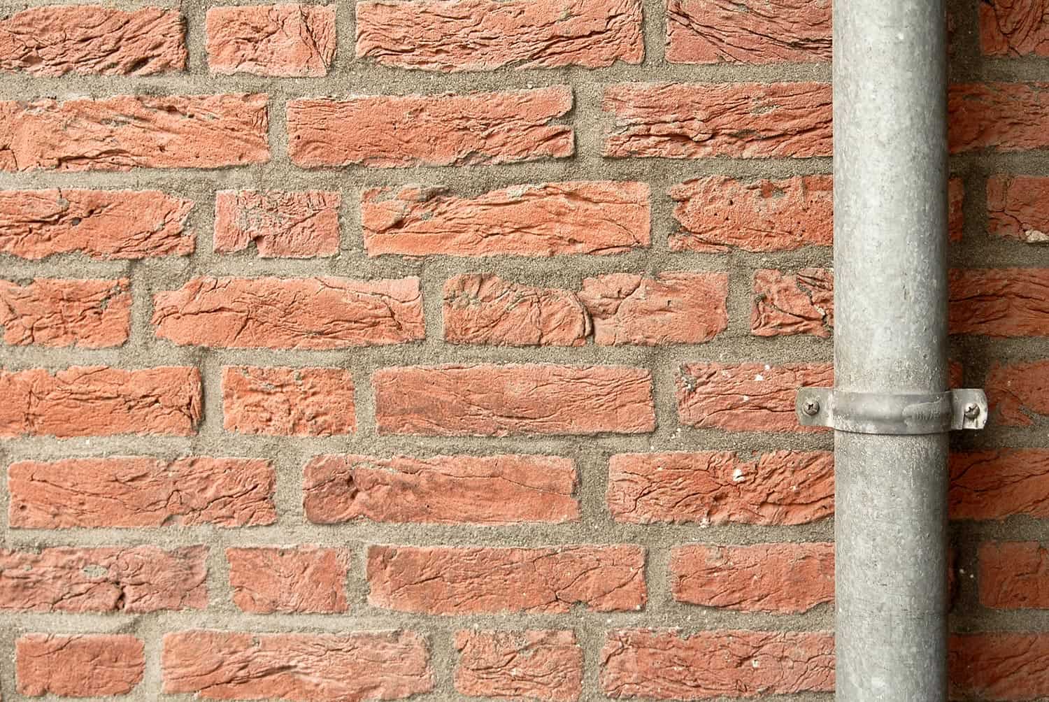 Brick wall and down pipe
