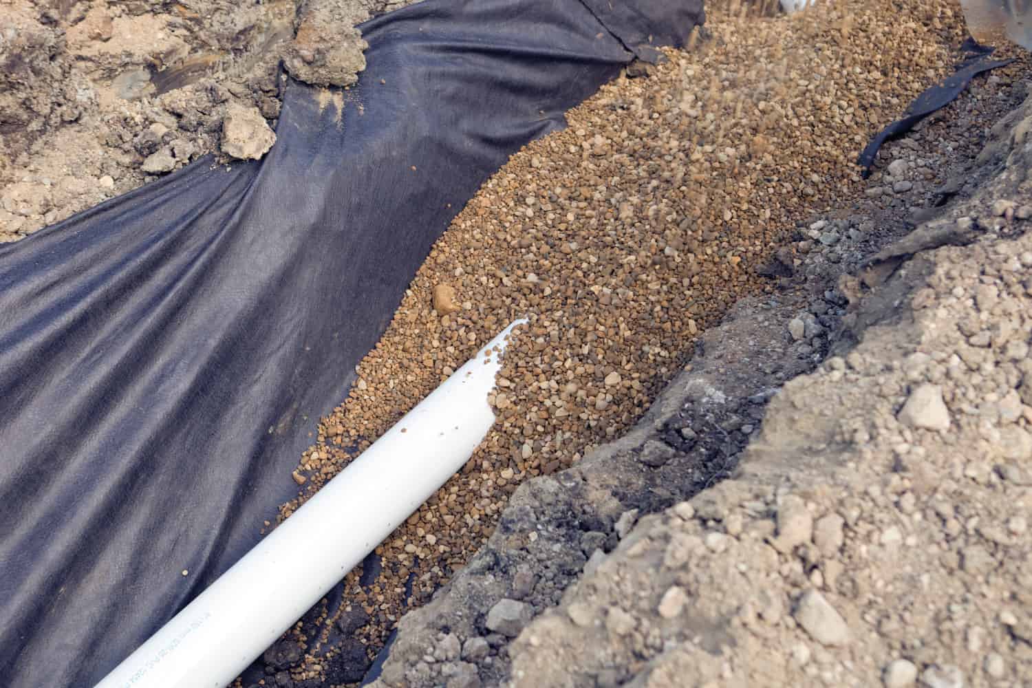 Gravel Covering a Large PVC Drainage Pipe