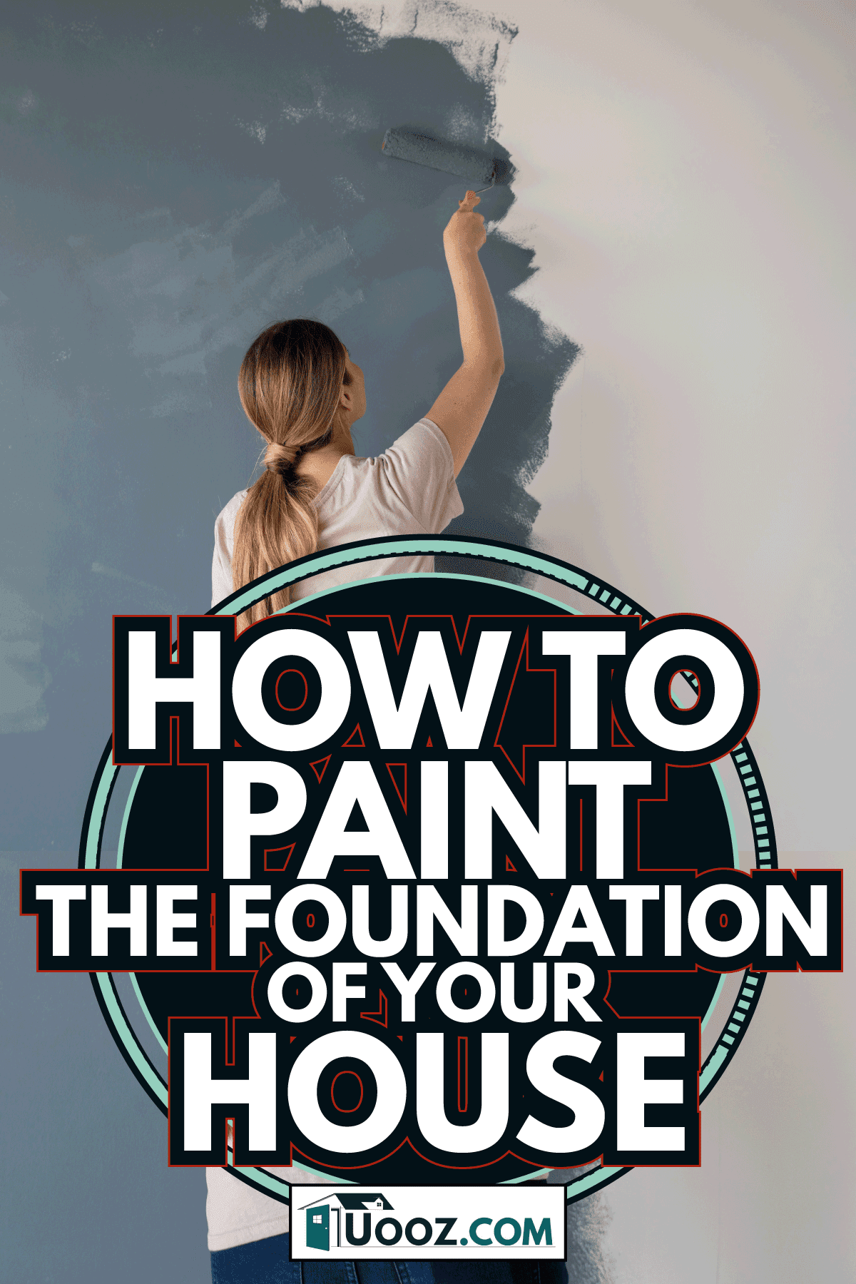 Woman painting a wall of her new house with a blue or grey color and using a paint roller. How To Paint The Foundation Of Your House