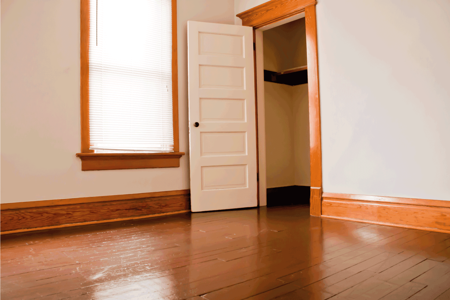 empty room with flush flooring and door jamb