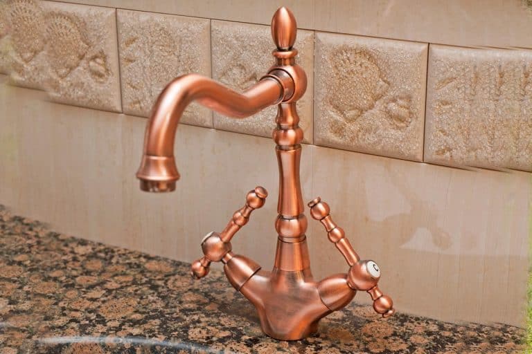 A bathroom tap on a washbasin, How To Change A Kitchen Tap With Copper Pipes