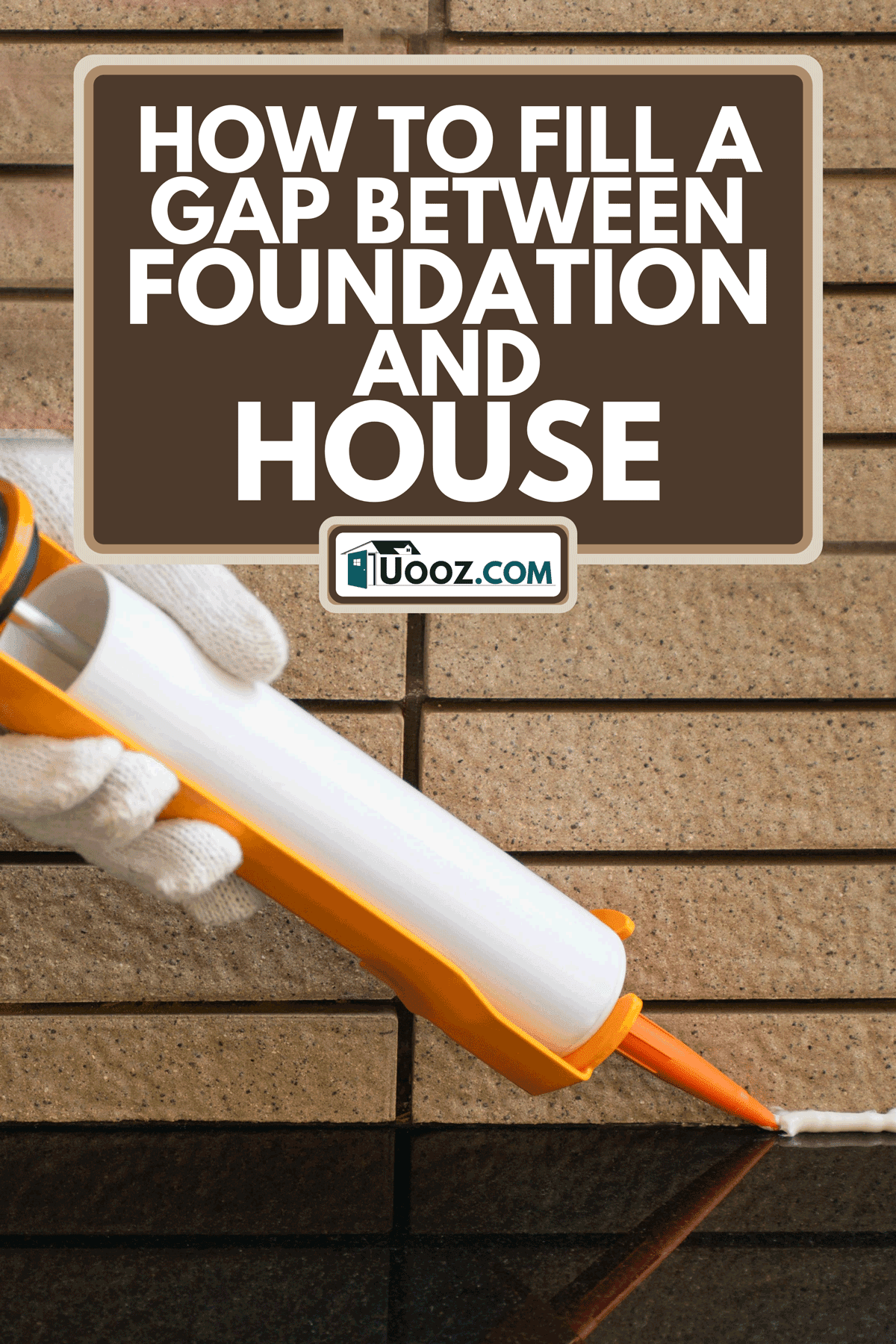 A technician holding glue gun with silicone adhesive, How To Fill A Gap Between Foundation And House