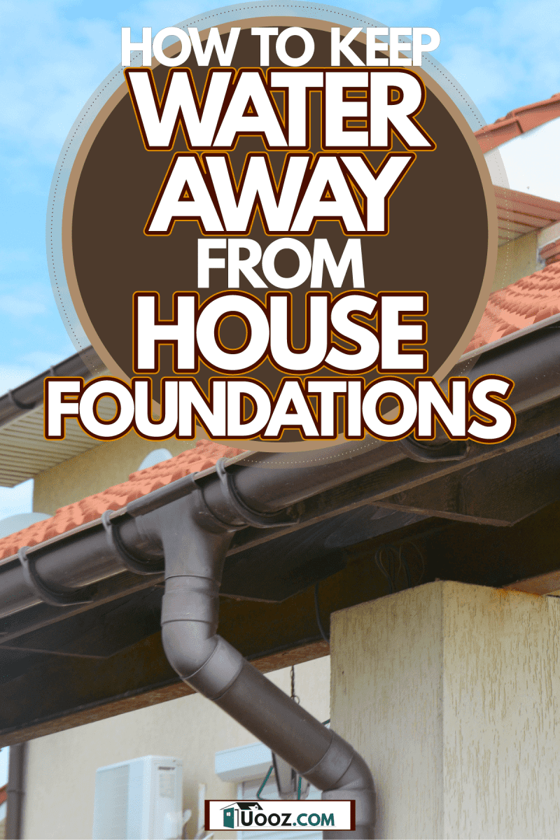 A reinforced gutter painted in brown of a modern house with metal roofing, How To Keep Water Away From House Foundations