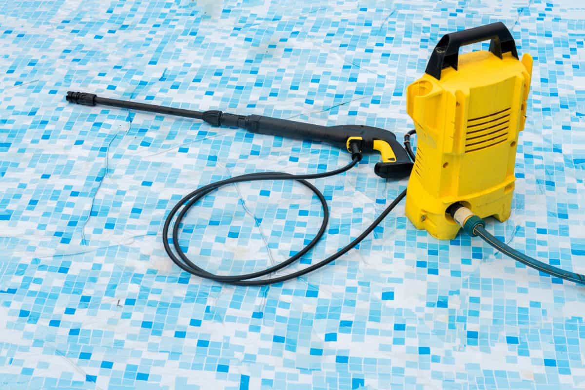 A Karcher pressure washer used in cleaning a pool