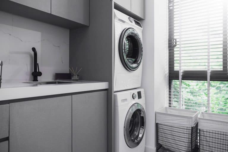 A washing machine and a dryer on top of it in the laundry room, Dryer Won't Start But Has Power - What To Do?