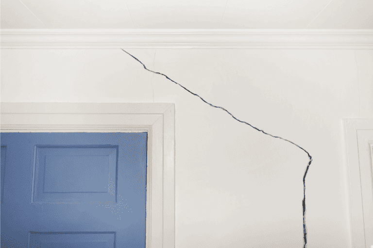 Crack-in-the-wall-of-a-home-near-door-and-door-jamb.-5-Types-Of-Cracks-In-Walls-[What-Homeowners-Need-To-Know]