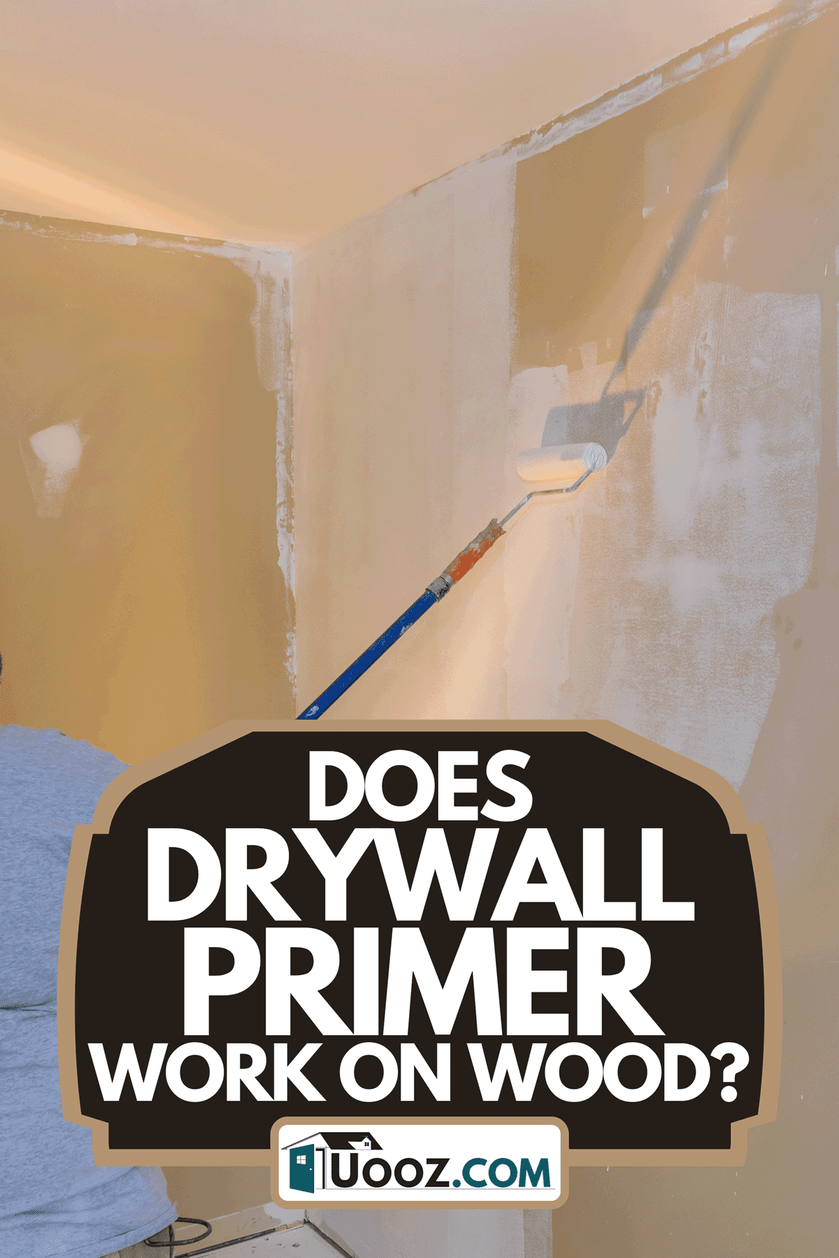 A worker priming with a paint roller, Does Drywall Primer Work On Wood?