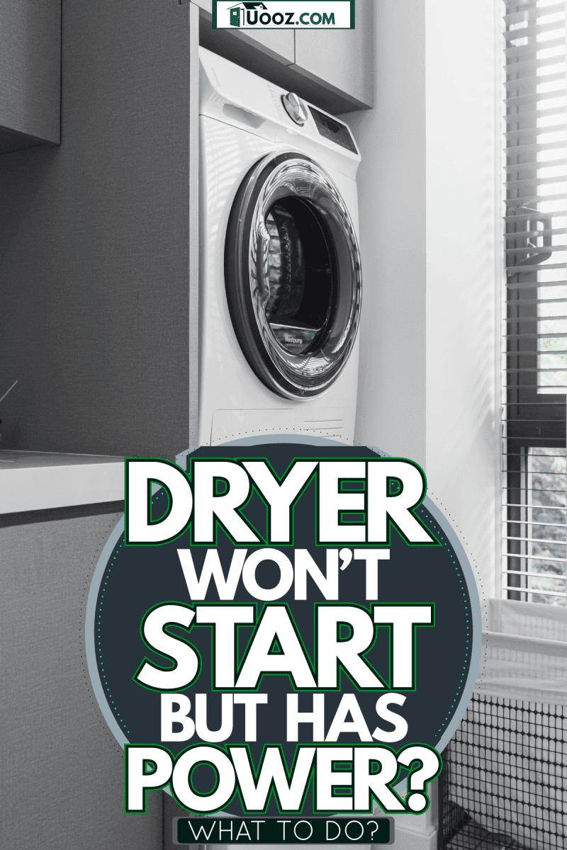 A washing machine and a dryer on top of it in the laundry room, Dryer Won't Start But Has Power - What To Do?