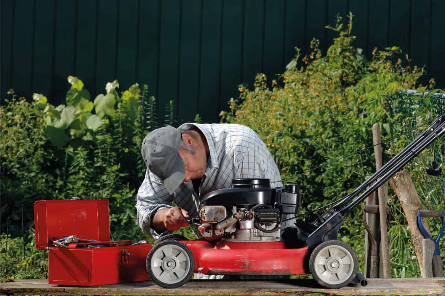 Man working on a lawnmower