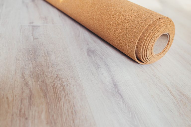 A cork underlayment in the living room floor, How To Install Cork Underlayment Under Tile Or Carpet