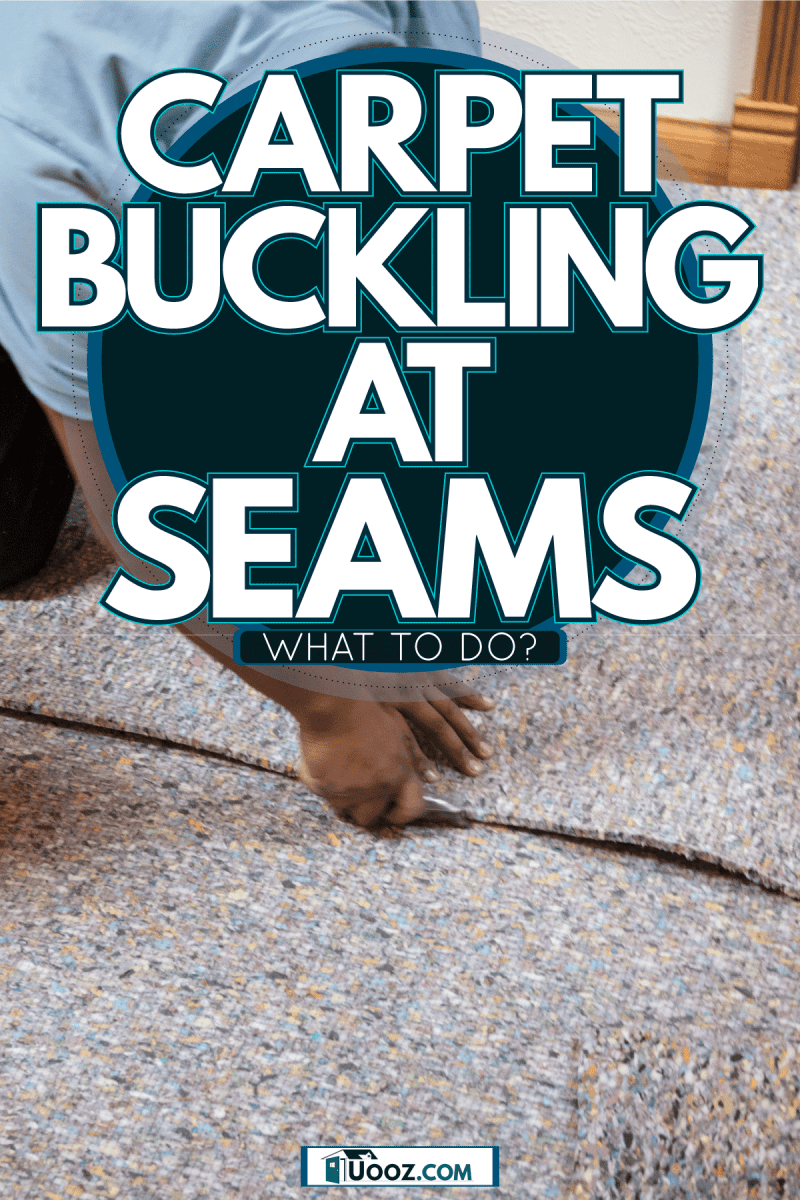 A worker installing carpet padding in the second floor, Carpet Buckling At Seams—What To Do?