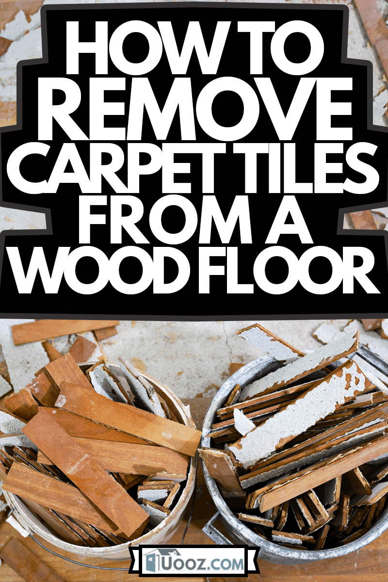 Craftsman in workwear removes the parquet flooring and fills the buckets with the wooden slats during the house renovation process, How To Remove Carpet Tiles From A Wood Floor