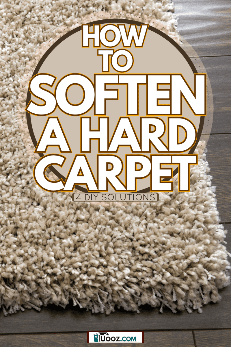 An up close photo of a hard carpet on the wooden flooring, How To Soften A Hard Carpet: 4 DIY Solutions