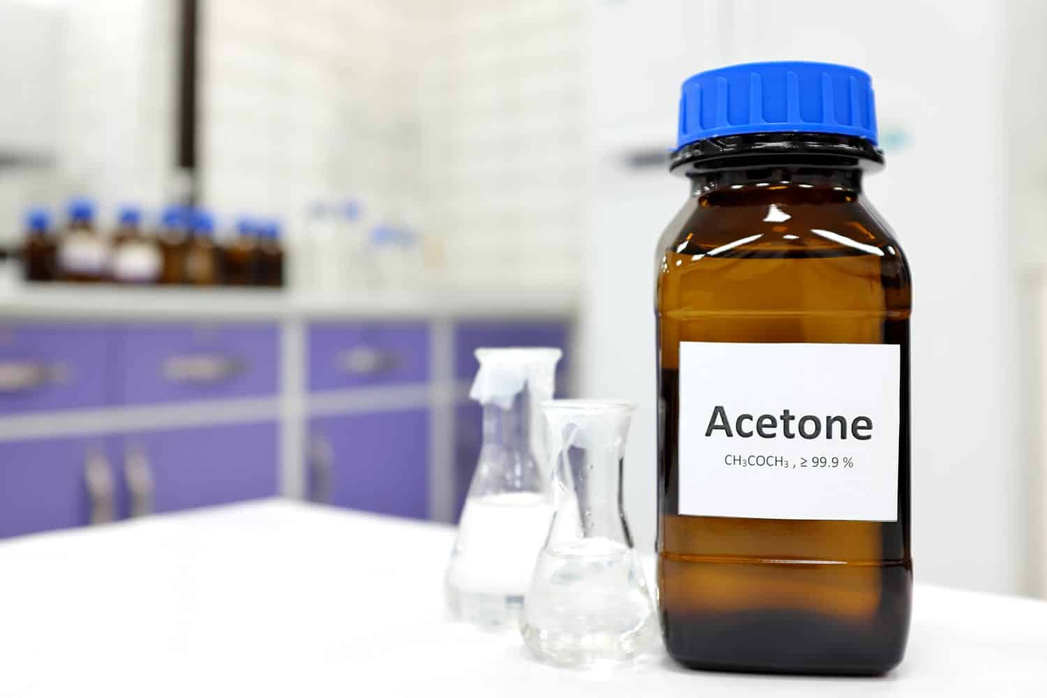 Selective focus of pure acetone solution in brown glass amber bottle