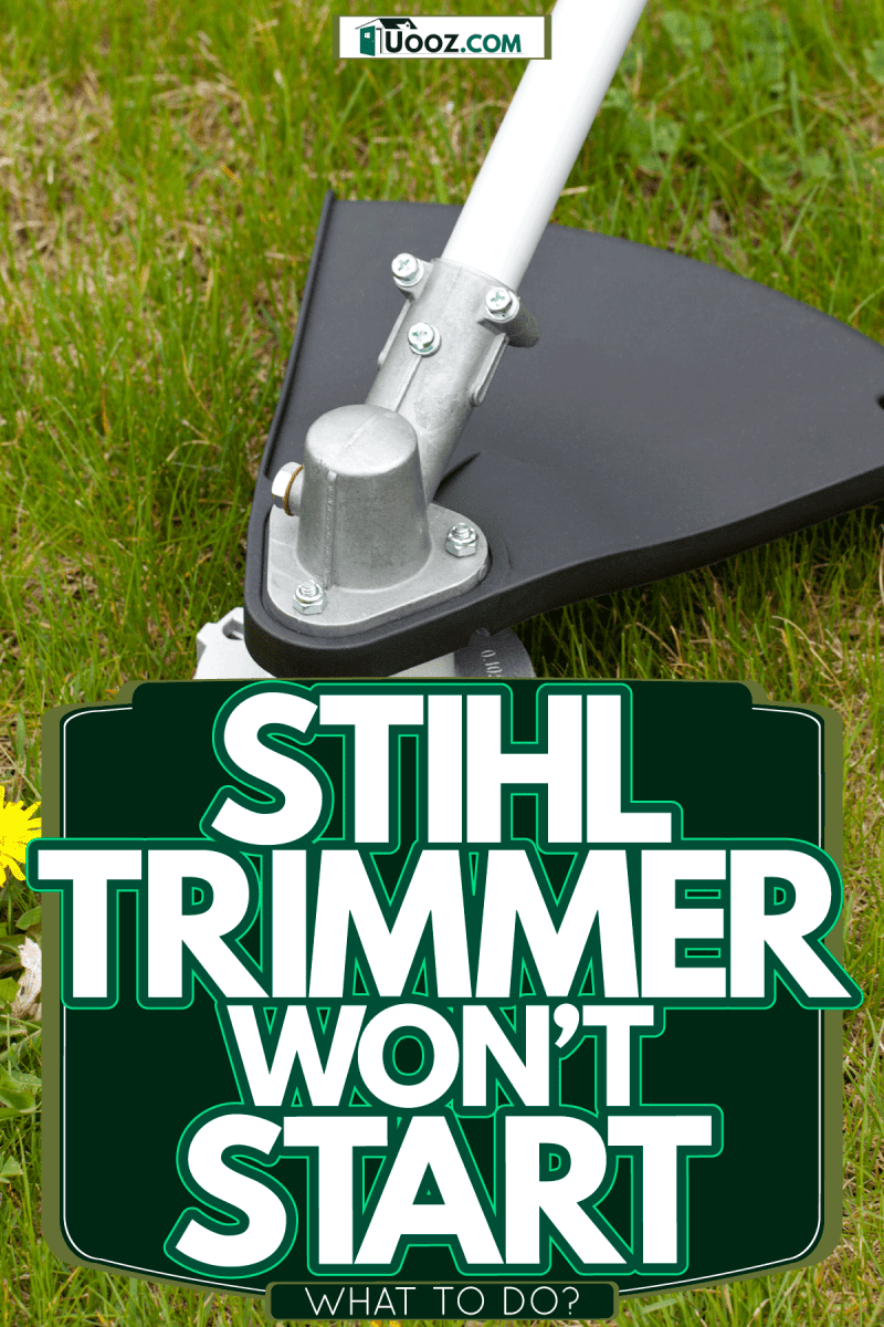 A grass trimmer cutting unwanted grass in front of his lawn, Stihl Trimmer Won't Start—What To Do?