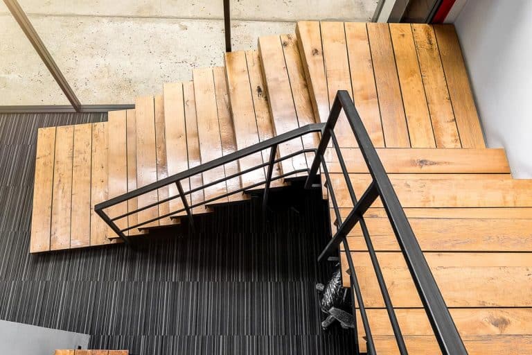 Wooden stairs at modern office, How Much Does It Cost To Change Carpet Stairs To Wood?