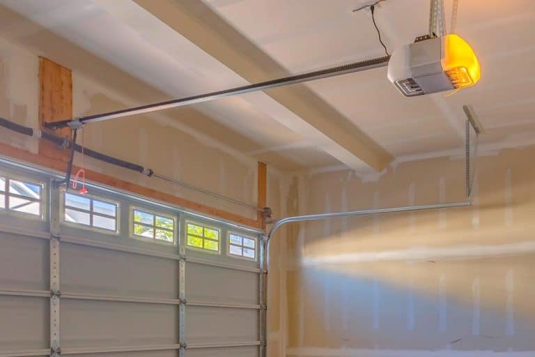An interior view of a garage under construction, How To Insulate A Garage Ceiling