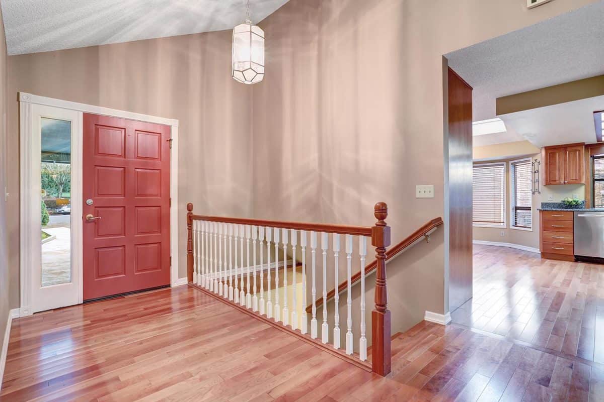 Simple entry way with hardwood floor and staircase