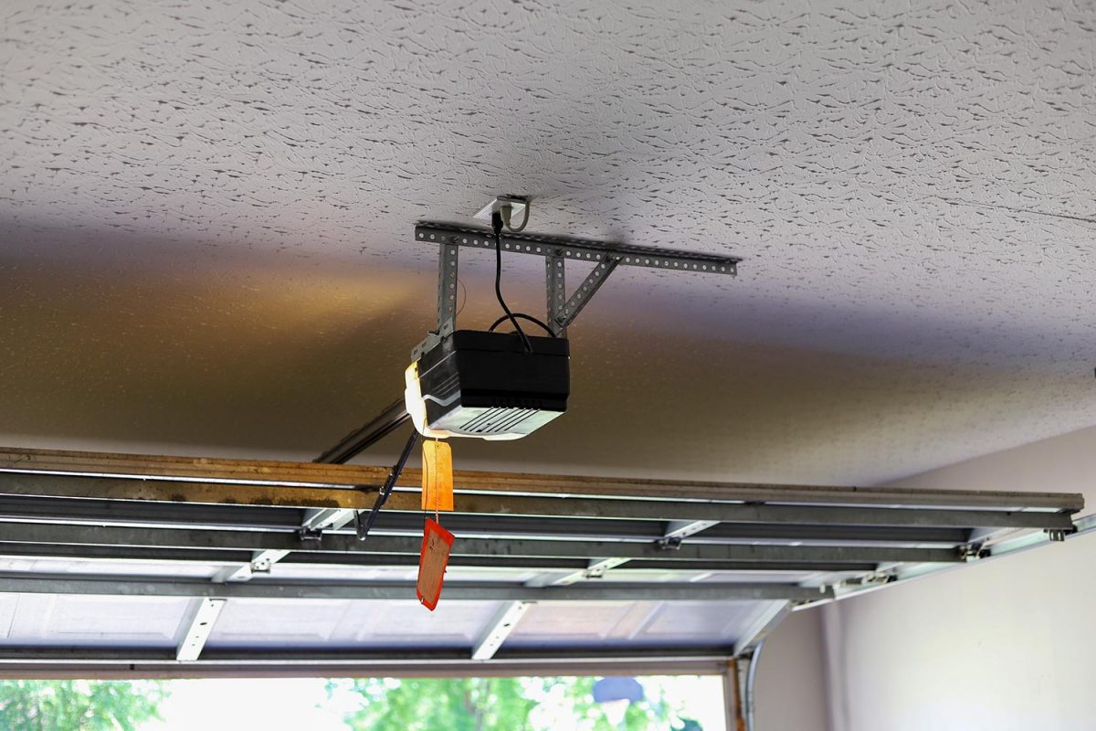 Automatic garage door opener motor on the ceiling