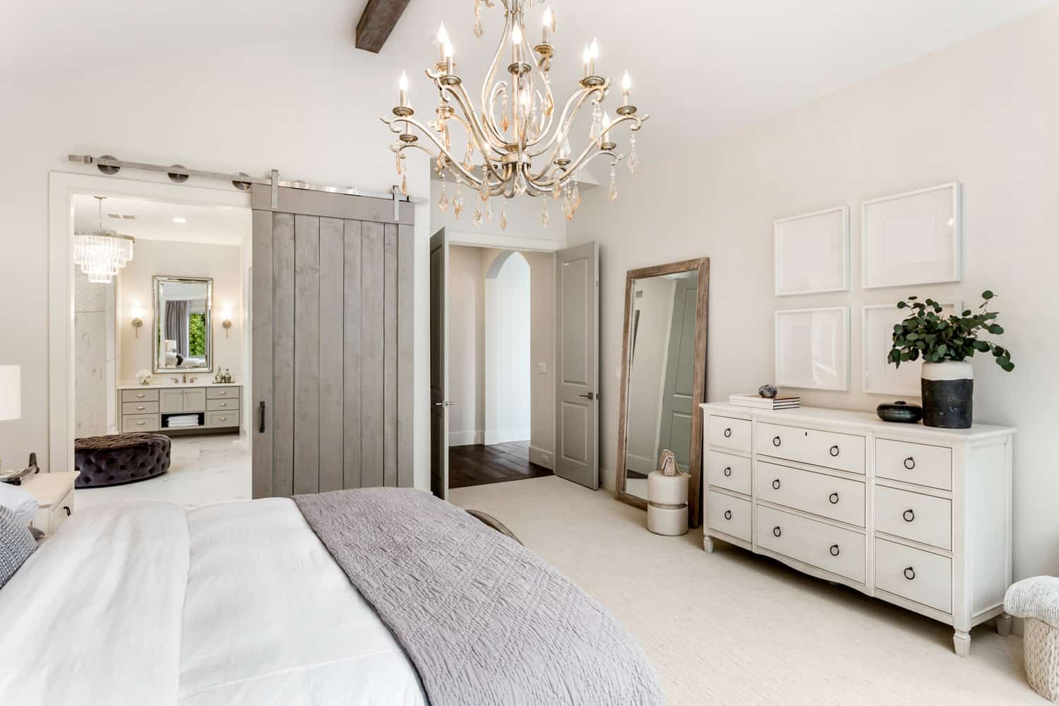 Beautiful master bedroom in new luxury home with view of ensuite master bathroom.