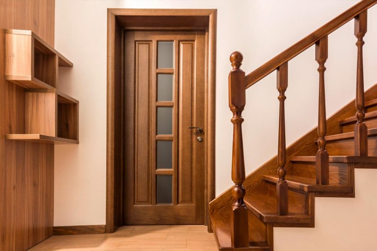 A modern brown oak wooden stairs and doors in new renovated house, What Color Floor Goes With Oak Doors?