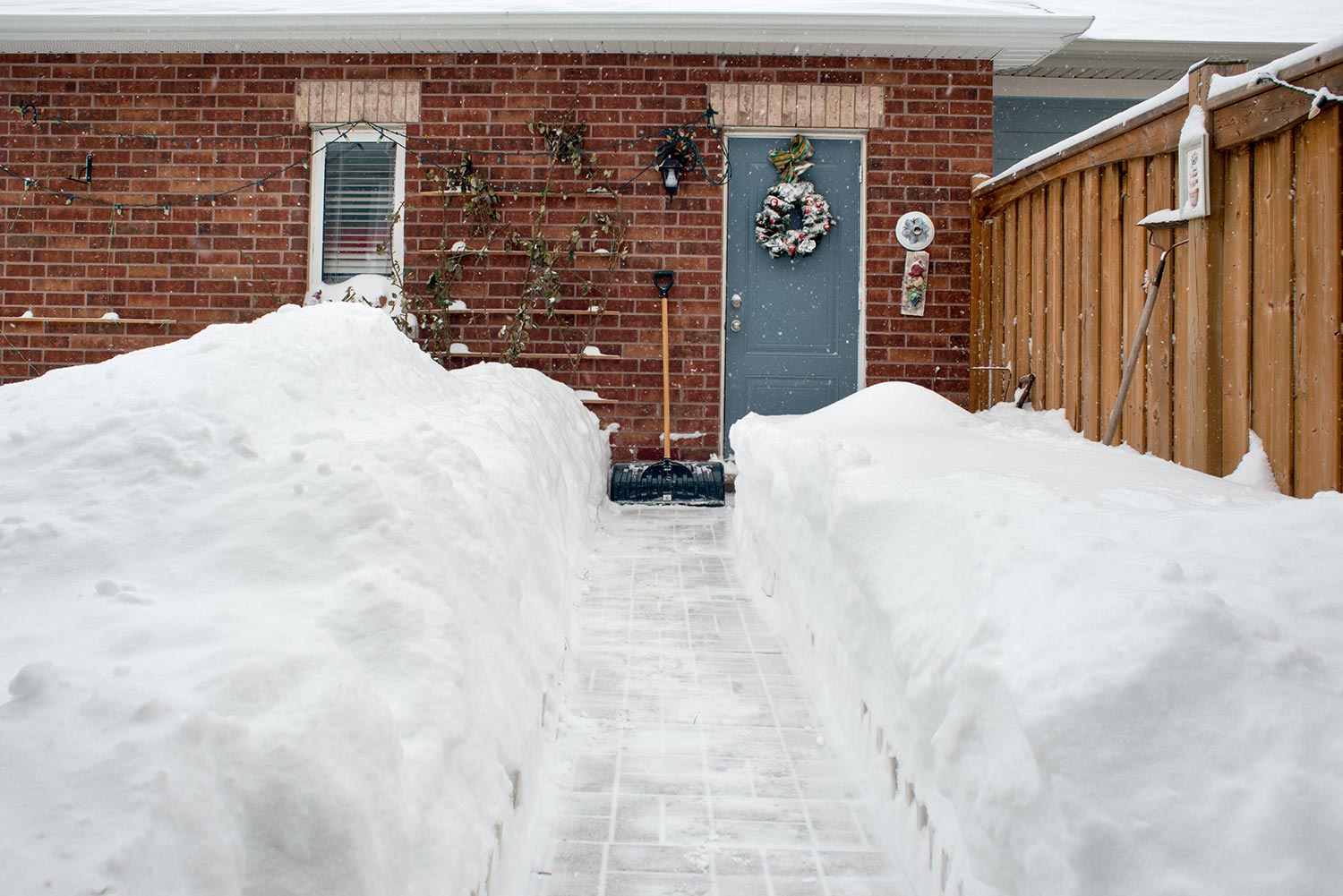 Residential garden covered in 2 feet of deep snow