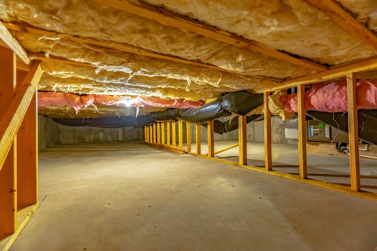 Basement floor insulation and wooden support beams