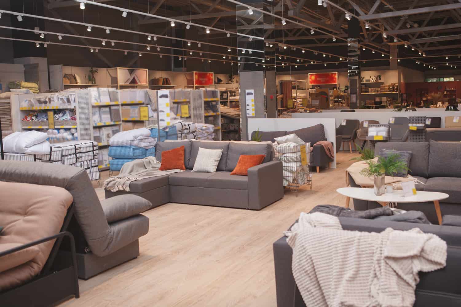 Furniture store with sofas and couches on display for sale, copy space
