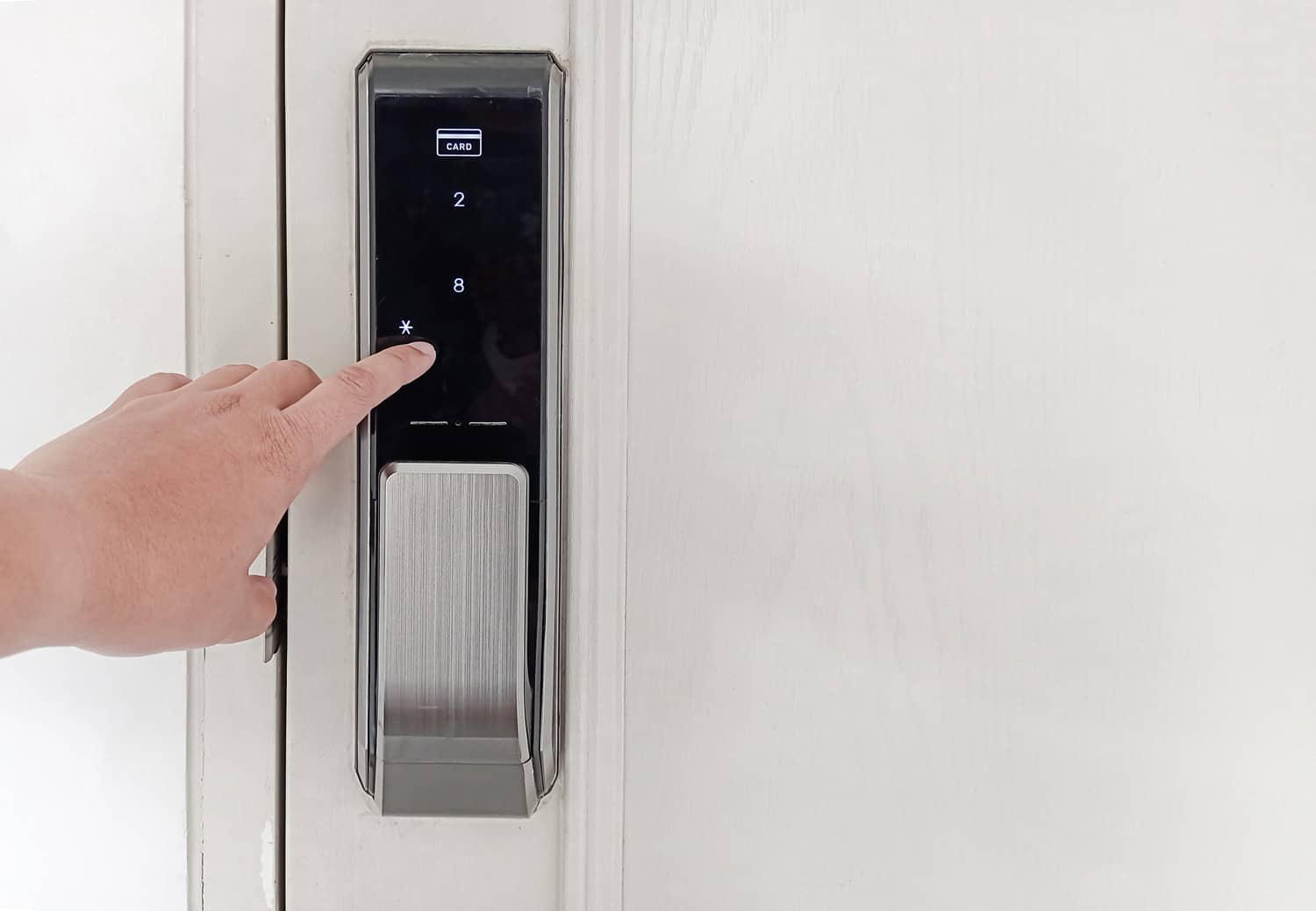 Home security system. hand pressing password code to lock and unlock door