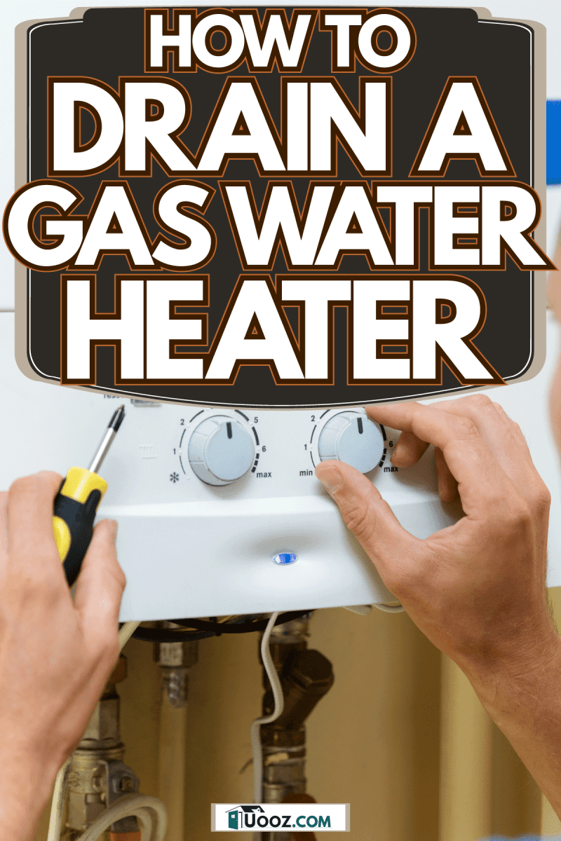 Repair technician checking the knobs of the water heater, How To Drain A Gas Water Heater