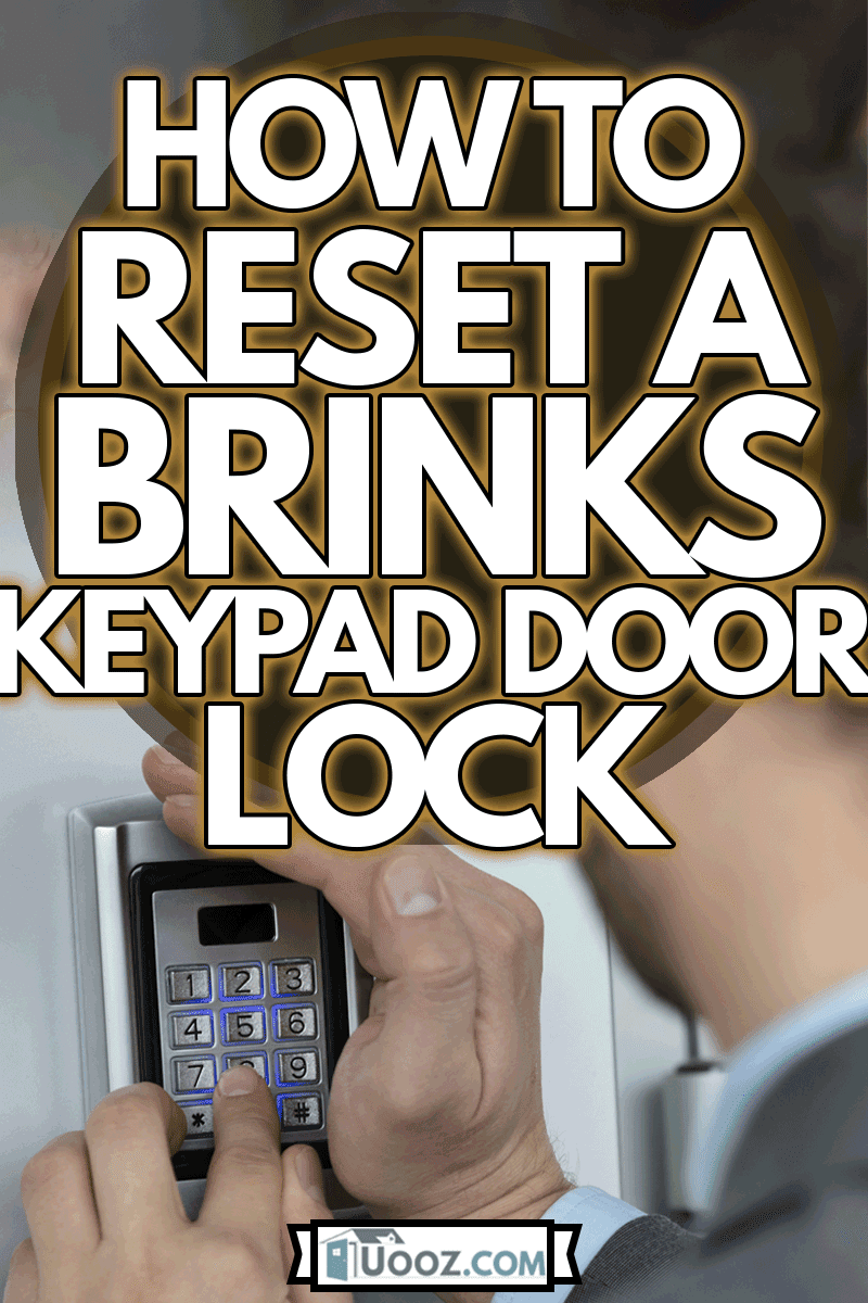 Close up of businessman hand entering pressing button on security system, How to Reset a Brinks Keypad Door Lock
